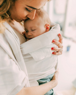 mom holding her baby close 