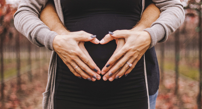 Man hugging his pregnant wife